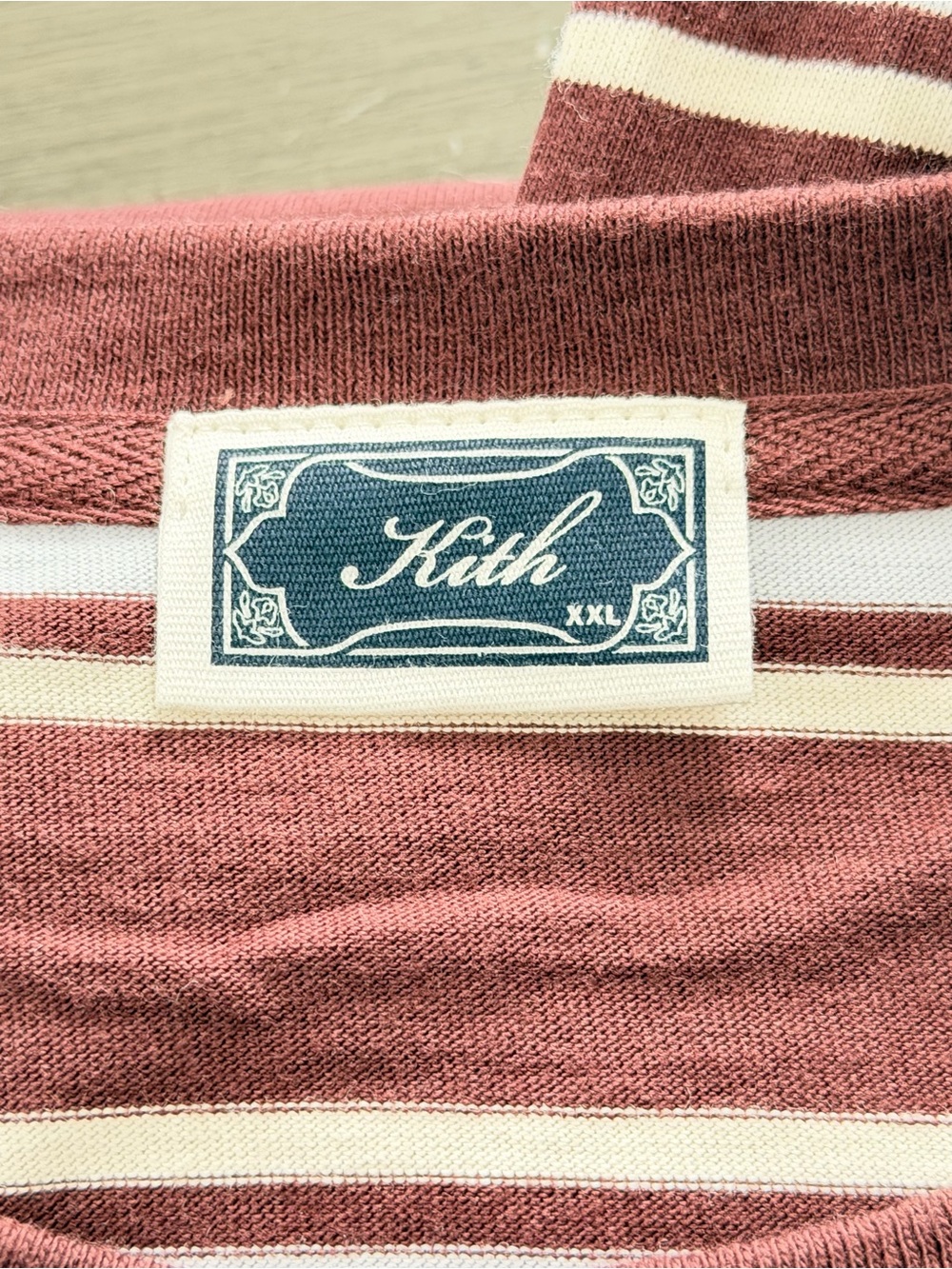 Premium Kith striped tee in a rich burgundy and cream colorway